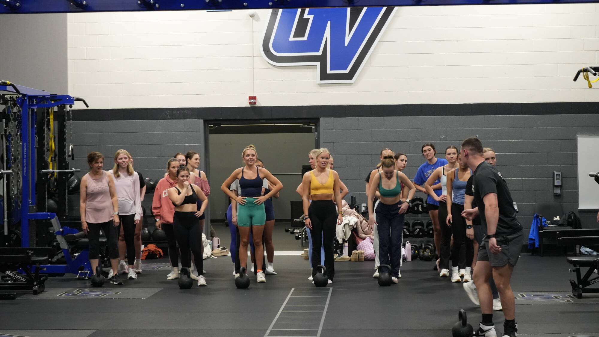 Photo of personal trainer, Frankie, leading Strength & HIIT class.
